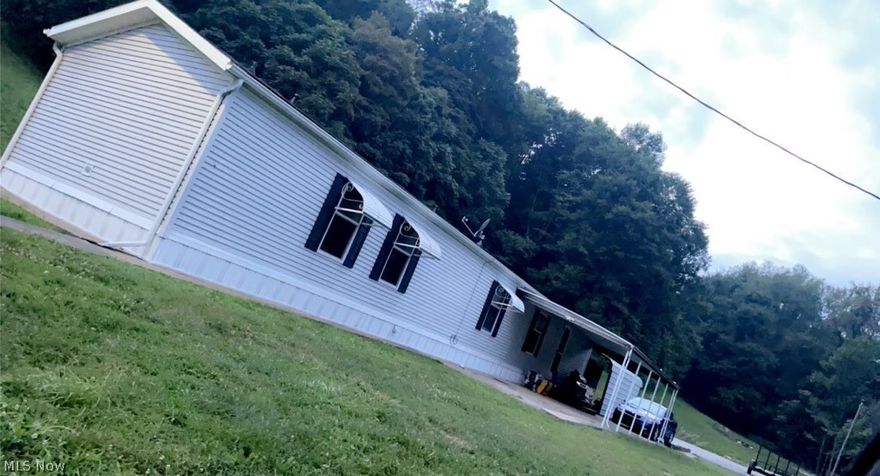 Come and see the beautiful views this property has! With around 10 acres wooded and 14 acres of beautiful hillside. This property has a recently updated mobile home, along with a covered porch, and a 24x40 Garage/shop. Not only is this a great property for wildlife it also has fantastic views from the top of the hill. This move in ready home is in the country but only a few minutes from town! Don't wait schedule your showing today!