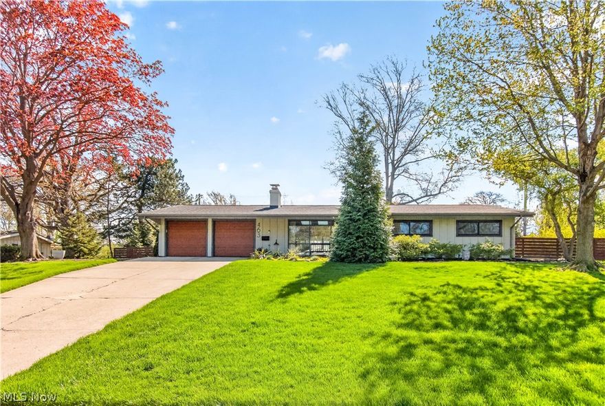 Tucked away on a quiet street, 463 Queenwood is more than a home—it’s a feeling. This completely reimagined Scholz Home is a  mid-century modern ranch that blends clean architectural lines with warm, intentional design, creating a space that feels both elevated & effortlessly livable. Thoughtfully planned for easy, single-floor living! The stunning, vaulted kitchen was designed to inspire featuring sleek IKEA cabinetry, Corian countertops, dual sinks, a modern tile backsplash, and a gas range come together in a space that’s equal parts functional and striking. The custom coffee bar invites slow mornings, while the unique commercial-grade flooring adds a bold, contemporary edge. The living room is anchored by a gas fireplace, creating the perfect ambiance for cozy evenings, while a Minka ceiling fan gently circulates comfort throughout. Solid ash doors add a layer of craftsmanship and warmth that carries throughout the home.The sunroom, with Nature Stone flooring, becomes your everyday escape with views of your private backyard oasis. A fully fenced yard surrounded by mature trees and lush perennials offers both beauty and privacy. Professionally designed landscape lighting transforms the front and back yards into a glowing retreat after sunset. 2 expansive patios set the stage for unforgettable gatherings, quiet dinners under the stars, or weekend lounging in your own sanctuary. Even the modern shed feels like an extension of the home’s aesthetic. Every detail has been thoughtfully updated—remodeled bathrooms, newer roof and skylights (2021), water heater (2023), garage Nature Stone flooring (2023), and newer double overhead garage doors (2020)—allowing you to simply move in and enjoy. All of this in a prime location just minutes from shopping, dining, Huntington Beach, Bradstreet's Landing and world-renowned University Hospitals, yet tucked into a peaceful neighborhood that feels worlds away. Effortless living, elevated design, and a home that simply feels right.