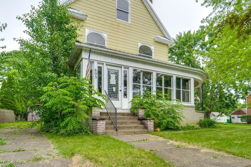 Welcome to 603 W. Market St., Orrville – a spacious 2,039 sq. ft. Colonial brimming with charm, character, and endless potential! This home showcases stunning original woodwork with ornate carvings, a gorgeous fireplace and mantel, and a unique switchback staircase that anchors its classic appeal. The oversized enclosed front porch and additional side porch offer inviting spaces to relax or entertain. Inside, you'll find a dining room that opens to the kitchen, complete with a central island. The first floor also features a full bathroom, laundry area, and a handy mudroom for added convenience. Upstairs, enjoy three generously sized bedrooms and a full bathroom with a soaking tub. The third floor offers two finished bonus rooms, ideal for a home office, playroom, or guest space. While the home needs a bit of TLC - it boasts a metal roof, 2-car carport, and plenty of potential to shine again. Located in the heart of downtown Orrville, this charming Colonial is waiting for someone to make it their own. Don't miss the opportunity to restore and personalize this timeless gem!