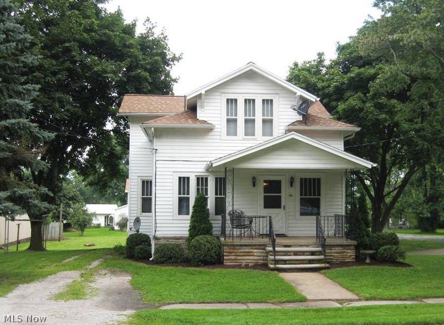 Two-Story 4 bedrooms, 2 baths home on a nicely treed double lot. What a change!  Updates include Firelands kitchen cabinets, appliances included, two new bathrooms, new carpet and newly painted throughout, steps to basement.  One car garage in the lower level and a 34x28 concrete block garage/workshop with a floored second story for storage.  Family room with fireplace.  Furnace set for central air.