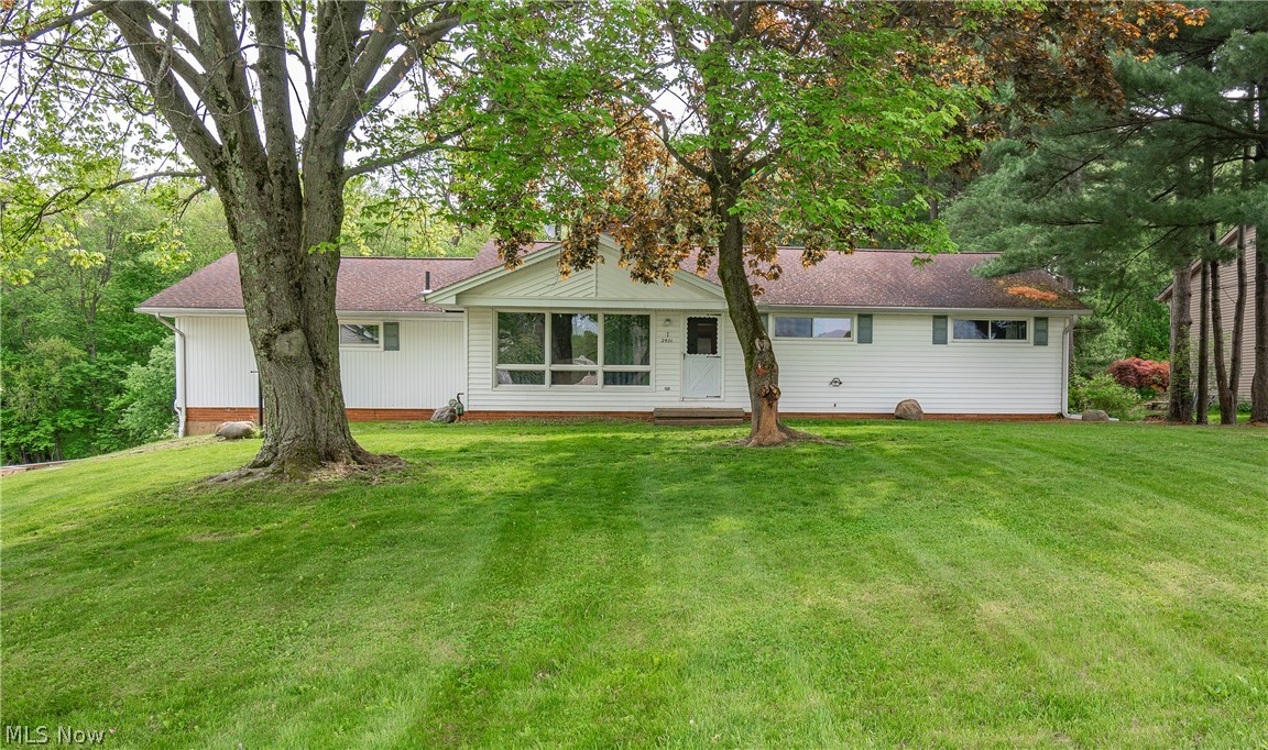 Welcome home to 2421 Woodview Road! Don't miss this beautiful three bedroom, three full bathroom ranch sitting on a peaceful .64 acre lot in Green! You will be greeted by a spacious main level offering an eat-in kitchen, living room, and family room with a cozy fireplace. Three great sized bedrooms sit down the hall with ample closet space. The main level also boasts two full bathrooms remodeled in 2020. Venture to the lower level to find an additional family room with a fireplace, a full bath, laundry area, and extensive storage space. Enjoy your evenings entertaining on your oversized deck overlooking the private backyard. The exterior also features an attached two-car garage and a detached two-car garage, offering endless space for storage and hobbies. Notable updates include: microwave 2021, retaining wall 2020, dishwasher 2020. Schedule your private viewing today!
