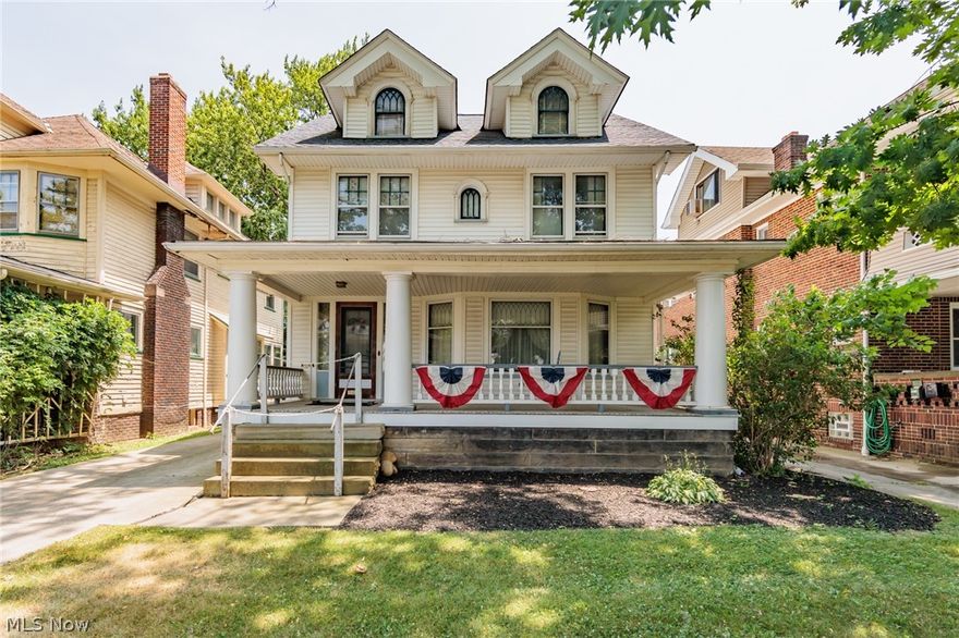 Welcome to 2665 E 130th, a 4 bedroom, 2041 sq.ft Colonial built in 1912. The exterior boasts attractive curb appeal with a sprawling covered front porch, shade trees and charming dormer windows. Inside this home awaits your personal touches yet offers beautiful natural woodwork, large windows with natural light throughout, spacious floorplan & ample storage. The main floor provides a lovely living room w/ beautiful bay window, formal dining room with built-in storage & beach seating, cozy office space or potential bedroom, eat-in kitchen with ample cabinetry & prep space plus a convenient 1/2 bath. The upstairs provides a hallway with built-in storage, 4 nice sized bedrooms all with wood floors, a shared full bathroom, enclosed porch to enjoy and stairs that lead up to a large attic space that has potential to be finished into a space that suits your needs. You will find more storage space, another full bathroom & a laundry area in the full basement. The backyard has a large, deep 1 car garage w/ attic storage. Updated electrical box w/ warranty plus a 1 year home warranty is also provided. Situated near the heart of Shaker Square, this home is near Major Medical, Educational & Cultural institutions, parks, restaurants & shopping. Schedule a showing and see how you can make this welcoming home your very own.