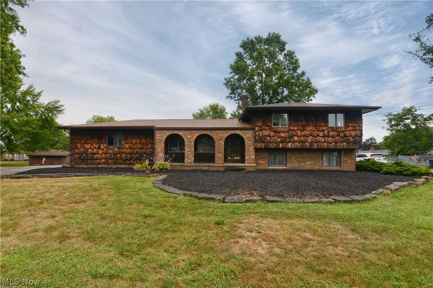 Wow!! Great find in the Village of McDonald has been given a face lift and is ready for a new owner! Freshly landscaped and mulched. Huge detached garage with an attached garage as well gives you so much room for storage and your outdoor items! Freshly painted home, with neat and tidy interior. The living room leads too the formal dining room and eat in kitchen with ample cupboard and counter space! Upstairs are three spacious bedrooms with great closets and a full bath with a tub shower combo! The lower level offers a huge family room the has a half bath and doors leading to the three season enclosed porch! The basement level has a large rec room with pebblestone flooring, laundry and utility area as well. The sq footage of the rec room is not yet computed in the sq footage stated in the MLS. Great sized yard! New cold Central air 2020. Updated roof in 2019! So much to offer, come see for yourself!