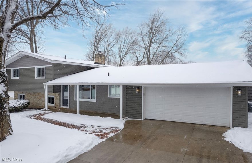 Modern Luxury Meets Nature: Renovated 3,600 Sq Ft Retreat. Discover the blend of modern sophistication and natural beauty in this renovated 5-bedroom, 5-bathroom (3 full, 2 half) split-level home. Backing onto Fairlawn Preserve and Nature Walk, this property is an opportunity to own a virtually new home in a prime Fairlawn location. Designed for entertaining and relaxation, the home features a brand-new gourmet kitchen with a quartz island, new cabinets, high-end stainless steel appliances, and a 6-burner cooktop. The open floor plan flows over refinished hardwoods and waterproof LVL flooring. The first-floor primary suite is a sanctuary, with an enormous walk-in closet, a private 2nd laundry room, a soaking tub, a double vanity, and a custom glass shower. A new family room, new 1/2 bath, and two fireplaces add warmth, while the filled-in pool area has been transformed into functional space, fully permitted and ready for the new owner. The renovation spared no detail: Exterior: New roof, siding, gutters, soffits, a 2-car attached garage with extra-large driveway, and a spacious rear deck overlooking the preserve. Mechanicals: Two new high-efficiency HVAC units, a Navien tankless water heater, all-new plumbing, electrical, LED lighting, and gas lines. Insulation up to R42 in new sections for energy efficiency. The original wing includes an additional master suite, 2 full baths, and 3 more bedrooms. The lower level has a 2nd laundry room, family room with walk-out to the fenced backyard, and an additional 1/2 bath. Neighborhood & Lifestyle: Step out your back door into the 66-acre Rosemont Preserve, with boardwalks and trails (coming in 2026). Located in the top-rated Copley-Fairlawn School District, you're minutes from Montrose's premium shopping and dining while enjoying a quiet, park-side lifestyle. If you're searching for the perfect home, look no further! Contact our office today to schedule a private showing or to submit your offer!