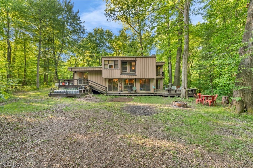 Escape the ordinary in this architecturally unique retreat nestled on 2.38 private wooded acres in Richfield Township. This one-of-a-kind contemporary home offers the perfect blend of character, comfort, and peaceful living with 3 bedrooms and 2 baths surrounded by nature and privacy. Warm wood beam ceilings, expansive windows, and rich natural finishes create an inviting atmosphere throughout the home, while the multi-level design adds both style and functionality. The updated kitchen is ideal for entertaining, featuring granite countertops, stainless steel appliances, and an oversized island that opens beautifully into the main living spaces. Multiple gathering areas provide flexibility for relaxing, hosting guests, or creating the perfect work-from-home setup. Step outside and enjoy the serenity of nature from the spacious decks and outdoor entertaining areas tucked among mature trees. If you’ve been searching for a home with architectural charm, acreage, and a true retreat-like setting, this Richfield Township gem is a rare opportunity you won’t want to miss. This location is amazing, you are so close to parks and skiing, literally just miles away! Call to set up a private showing today!
