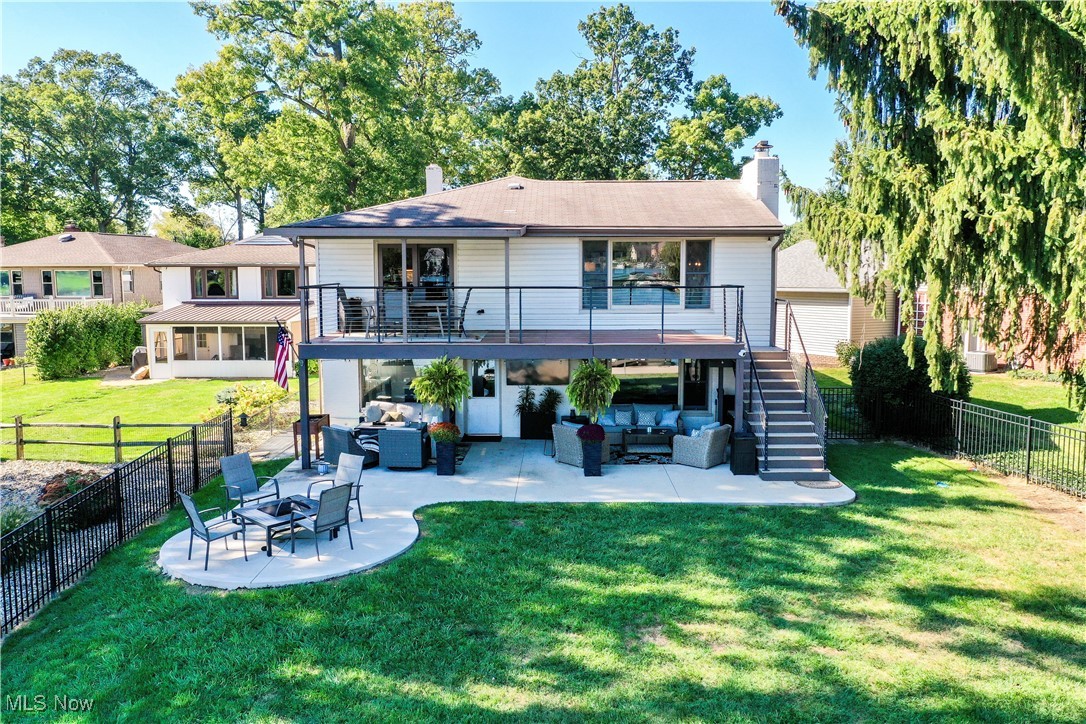 Enjoy lakefront living in this charming, updated home that blends timeless character with modern comfort. Nestled directly on the water, the property features a desirable walk-out first floor that opens to a spacious patio—perfect for relaxing or entertaining at the water’s edge. The large deck offers sweeping lake views and the ideal spot for morning coffee or evening sunsets. Inside, you’ll find thoughtfully updated finishes while still retaining warmth and character. The kitchen and living room provide a large open area that is great for entertaining.  The first floor offers a fantastic family room with a nice bar area. With generous living areas, abundant natural light, and multiple outdoor spaces to enjoy the waterfront, this property is a perfect retreat for year-round living or a weekend escape.