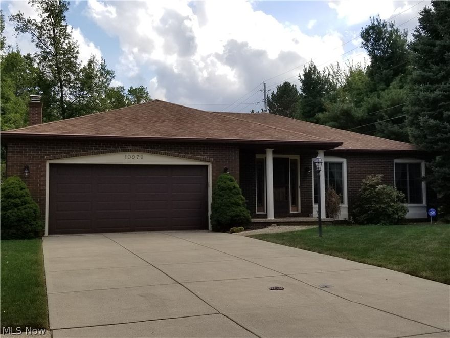 Don't miss this one of a kind all brick ranch nestled at the end of a dead end street**Just steps from the Metroparks and its all purpose trails makes this location ideal**Step right in to the spacious foyer and enjoy this easy floor plan**This home features an eat-in kitchen with lots of counter space, cabinetry, large pantry, breakfast bar for your convenience and comes complete with all the kitchen appliances**Enjoy the formal dining room for all your special occasions**One step down to the beautiful family room with full wall wood burning fireplace, built in bookshelves and wet bar; makes this home perfect for entertaining**Natural wood paneled doors throughout give this home an upscale yet warm feel**The master bedroom offers its own private bath, his and hers closets and plenty of room**Double sink in the hall bath is an added convenience**Updated Anderson slider off the family room leads to the spacious patio with lots of privacy which is perfect for entertaining or just relaxin