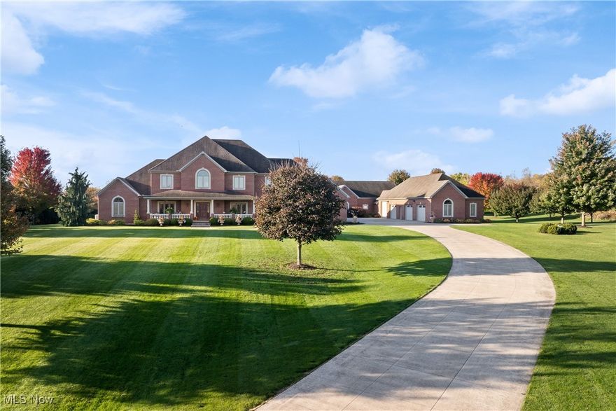 Spectacular 8.77 acre estate where charm, quality craftsmanship and functionality meet.  This brick 6487 sq. ft.  5 bedroom, 5-1/2 bath home offers a picturesque countryside view from every window. Attention has been given to every detail of this home.  The kitchen is truly a gourmet's dream with custom cherry cabinetry, huge center island and top of the line appliances and a large walk-in pantry.  The open concept flows into the gathering room that features a 3rd fireplace with t.v. above.  Impressive 2-story foyer and great room, formal dining room, library, year round sun room and luxurious master retreat and oversized laundry on 1st floor.  3 huge bedrooms with ensuite baths on 2nd floor, with loft, 2nd laundry and a large storage room.   There's an additional 2300 sq. ft. on lower level with fully equipped kitchen, theater with equipment and more! 2936 sq. ft. pool house, barn, pond, and back yard retreat!  Bonus 8 car garage.