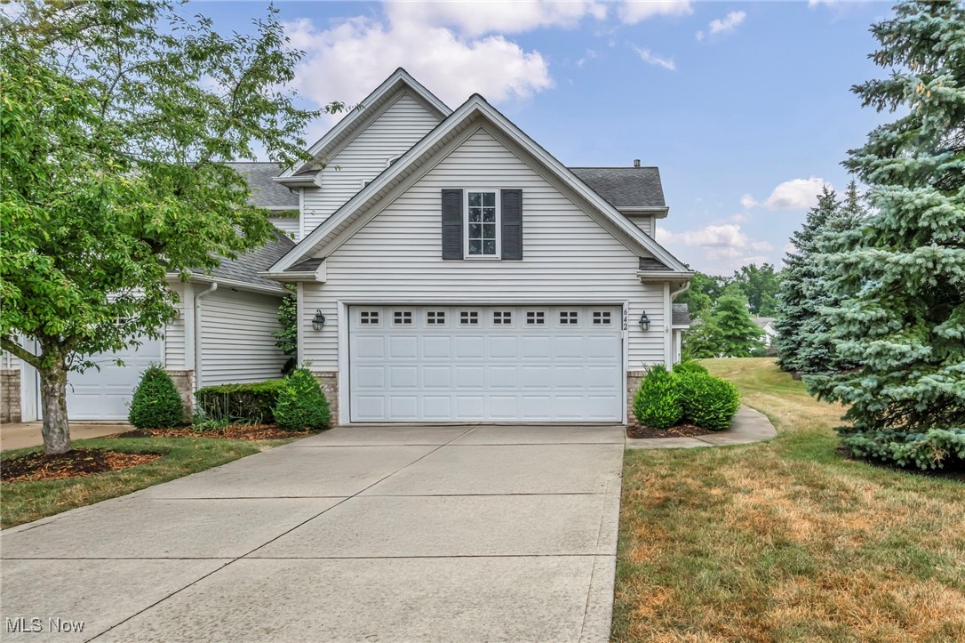 This absolutely stunning 2 bedroom plus loft, 2.5 bath contemporary-style townhome in the Wildberry Subdivision is a rare and highly coveted end unit, which means you enjoy natural light on three sides thanks to extra windows and skylights, while also benefiting from increased privacy. It shares only one wall, reducing noise and enhancing tranquility. Bathed in sunlight throughout the day, the home overlooks extra green space and is near the community pool, with visitor parking just a few feet away. Inside, the soaring two-story great room features high ceilings, skylights, and neutral tones; an open loft with a closet; a spacious primary suite with a glamour bathroom including a jetted tub and separate shower; and an oversized second bedroom with a dramatic two-story ceiling and walk-in attic storage. Relax in the sunroom, complete with a skylight and sliders to the brick patio, living room, and family room, further brightens the space. Get cozy around the three-sided fireplace! A convenient first-floor laundry/utility room houses a newer hot water tank and the attached two-car garage with a double-sided driveway offers ample parking. This end-unit gem truly blends modern luxury, abundant light, and community convenience into one breathtaking package.