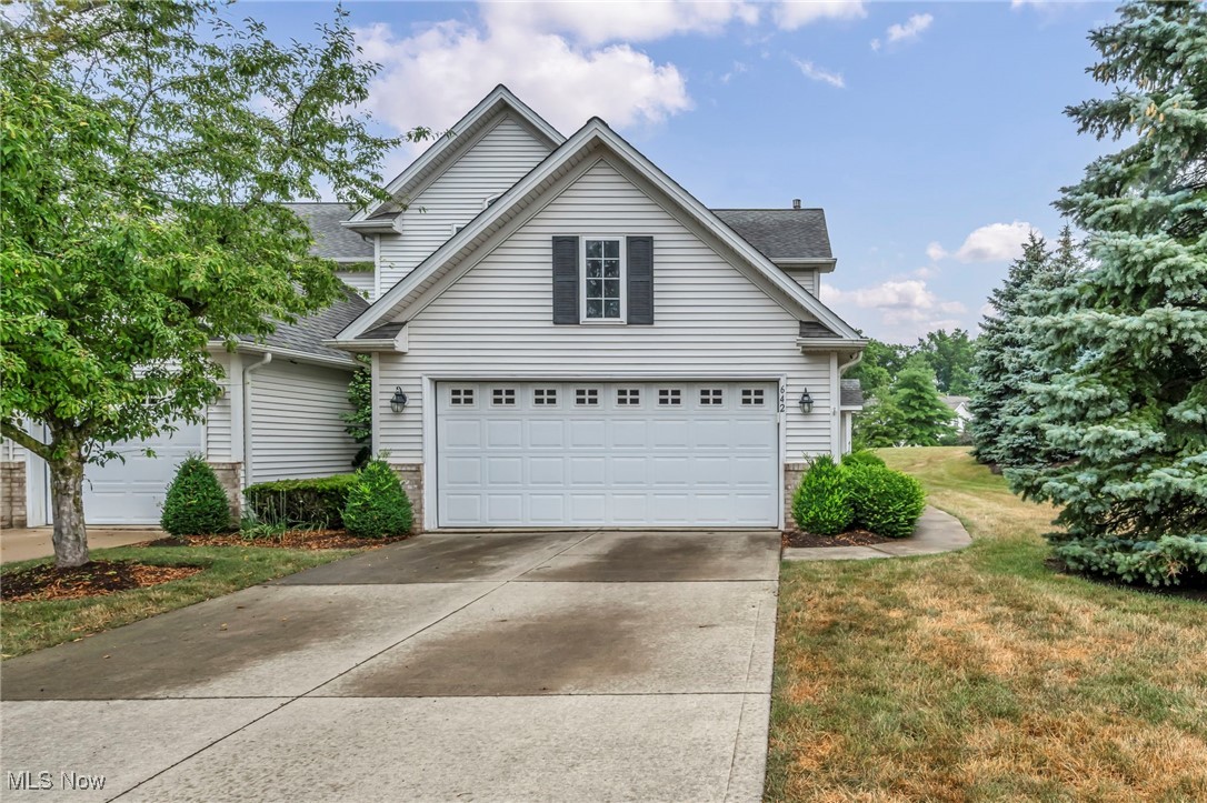 This absolutely stunning 2 bedroom plus loft, 2.5 bath contemporary-style townhome in the Wildberry Subdivision is a rare and highly coveted end unit, which means you enjoy natural light on three sides thanks to extra windows and skylights, while also benefiting from increased privacy. It shares only one wall, reducing noise and enhancing tranquility. Bathed in sunlight throughout the day, the home overlooks extra green space and is near the community pool, with visitor parking just a few feet away. Inside, the soaring two-story great room features high ceilings, skylights, and neutral tones; an open loft with a closet; a spacious primary suite with a glamour bathroom including a jetted tub and separate shower; and an oversized second bedroom with a dramatic two-story ceiling and walk-in attic storage. Relax in the sunroom, complete with a skylight and sliders to the brick patio, living room, and family room, further brightens the space. Get cozy around the three-sided fireplace! A convenient first-floor laundry/utility room houses a newer hot water tank and the attached two-car garage with a double-sided driveway offers ample parking. This end-unit gem truly blends modern luxury, abundant light, and community convenience into one breathtaking package.