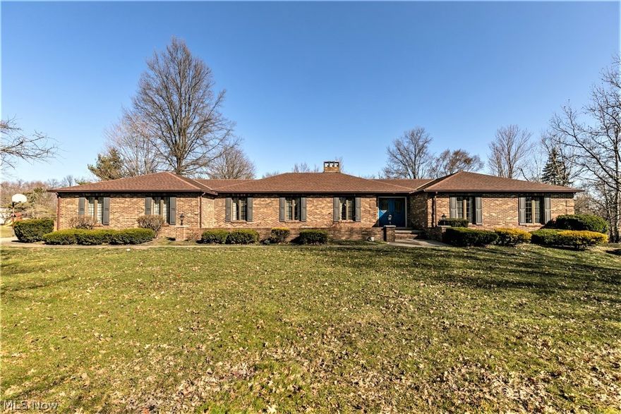 Looking for country living, while still being conveniently located?  Here you go!  This 3400+ sq ft brick ranch with an oversized 3-car garage is nestled on 4.3 gorgeous acres at the end of a very private street in Eaton Twp.  A great floorplan awaits, including 4 very large bedrooms and 3 full baths.  The kitchen has so much cupboard and counter space, a built-in desk - Plus a large eat-in area with backyard view to enjoy while having your morning coffee.  The welcoming family room features wooden ceiling beams, a beautiful fireplace, and built-in bookcases.  French doors open to the huge four-season sunroom with a wall of windows and a set of sliding doors on each side which open to cozy patio areas.  Here you’ll have stunning views of the expansive back acreage and all the wildlife that comes to visit.  The open dining room and living room are great for entertaining.  A spacious laundry room/mud room has lots of storage space and a walk-in cedar closet.  Need even more space?  Check
