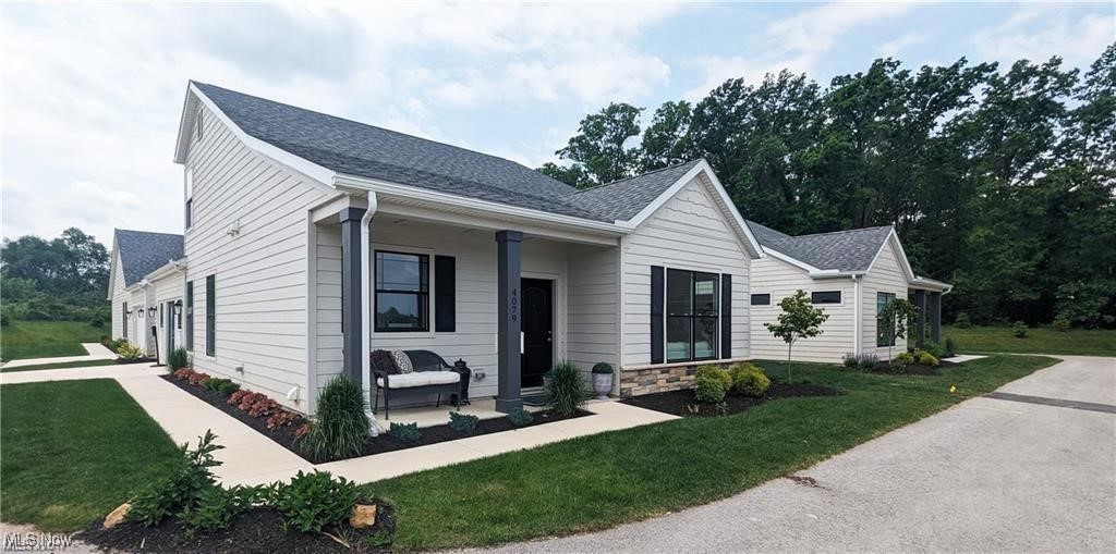 Move-In Ready Builder's Model *INCENTIVE INTEREST RATE BUYDOWN 4.62%. Must close by August 31, 2025. Restrictions apply. Single detached new home at the Cottages at Plum Brook. Findlay floor plan is a 2 story with 1st floor primary suite and 2nd bedroom, bath, and loft up, sunroom, 2 ½ baths, island kitchen, front and back covered porch, patio with privacy fence, 2 car garage. The second floor is perfect for an in-law suite, out-of-town guests, hobby area or workspace. Many upgrades including quartz countertops, luxury vinyl plank flooring, fireplace. Remember the days when people had summer cottages by Lake Erie, we've brought those days back! Enjoy a maintenance-free lifestyle with exterior repairs, landscaping, and snow removal taken care of. Minutes to freeways, shopping, medical facilities, dining, entertainment, marinas. Ride your golf cart across the street to Plum Brook Country Club, walk to Osborn Metro Park with dog park and walking trails. Clubhouse, Pool, Fitness Center to be built. FHA & VA approved. Open SATURDAY & SUNDAY 1-3pm.