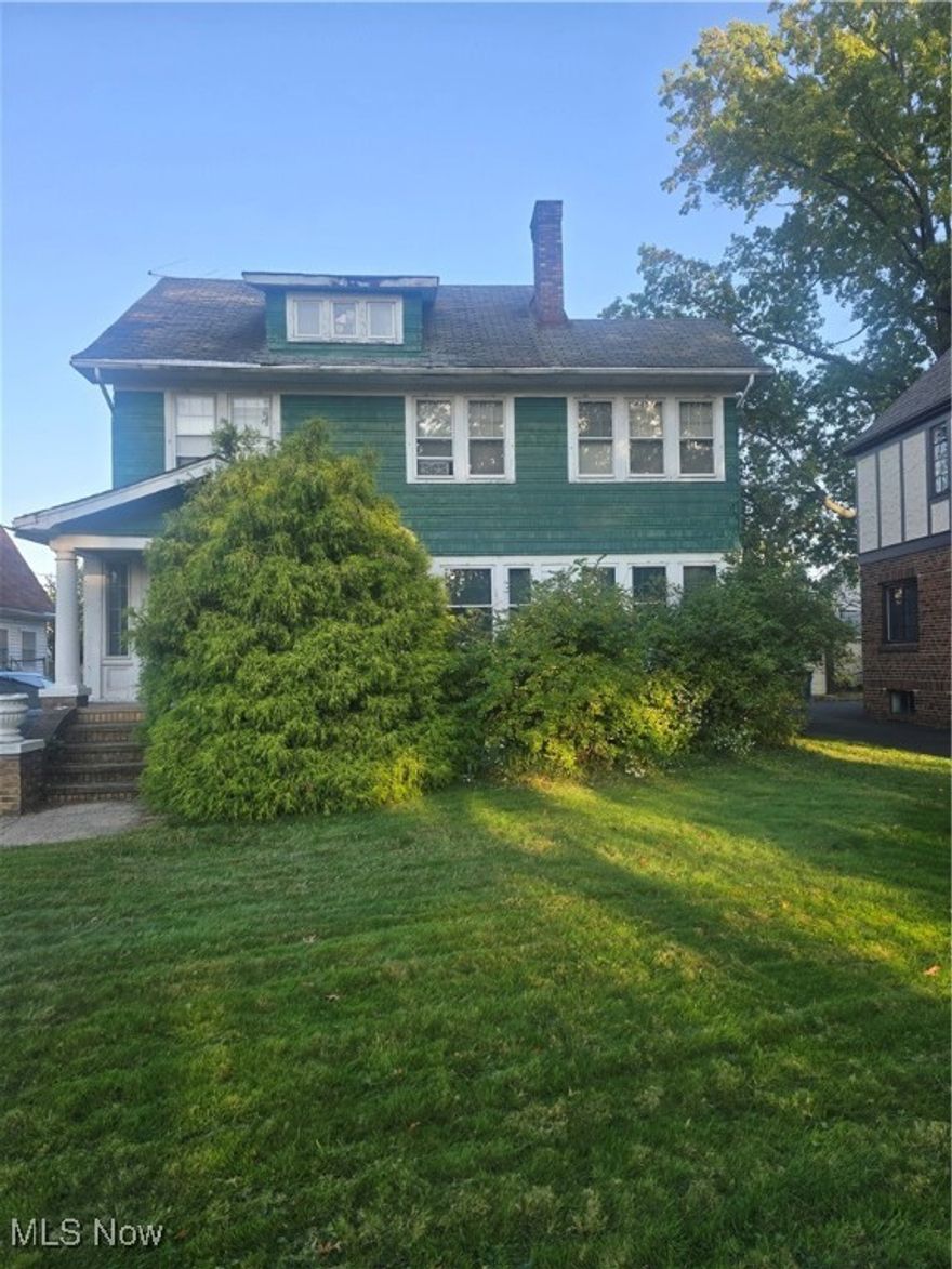 Opportunity knocks in Lakewood! This Large 3-bedroom, 1.5-bathroom colonial offers strong potential for investors or buyers ready to restore its historic charm. With the same owner for over 40 years, much of the original character remains intact—including detailed woodwork, leaded glass built-ins in the formal dining room, and a double-sided fireplace between the family room and sunroom. There is a third floor attic that can be finished for more space and square feet.
Several bonus spaces add to the appeal, including a walk-in closet or nursery off the primary bedroom and a main-floor sunroom. While the home is in need of updating and TLC, the layout, preserved details, dry basement and desirable location make this a solid investment opportunity. Outside you will find a newer two car garage for your outdoor parking needs.
Perfectly positioned within walking distance to schools, parks, the library, pool, coffee shops, restaurants, and nightlife—with easy access to major highways, Edgewater Park, the Shoreway, and downtown Cleveland—this home is ready for a new owner to bring it back to life. Don’t miss your chance to transform a Lakewood classic! Schedule a showing today!