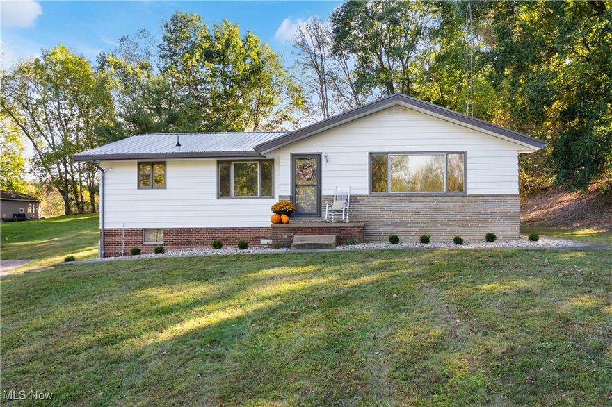 Welcome home to this charming 3-bedroom, 1-bath ranch nestled on a beautiful 0.96-acre lot along a quiet country road in the sought-after Tuslaw School District. Step inside to a spacious living room filled with natural light from the large front window, creating a warm and inviting atmosphere. The kitchen features its original charming cabinets and an adjoining dining area—perfect for family meals or morning coffee. Down the hall, you’ll find three comfortable bedrooms and a completely remodeled full bathroom.
Enjoy the original hardwood floors that flow throughout the home, adding timeless character. The unfinished basement provides endless possibilities for additional living space or storage and offers convenient access to the attached 2-car garage.
Outside, relax and take in the peaceful setting surrounded by open views and fresh landscaping. You’ll appreciate the metal roof (2022), updated electric, fresh exterior paint, new landscaping, and new storm doors—all the updates that make this home move-in ready! Located just minutes from Route 21, 93, and 30, you’ll have easy access to shopping, restaurants, and more—while still enjoying the serenity of country living. Don’t miss your chance to make this beautiful property your next home!