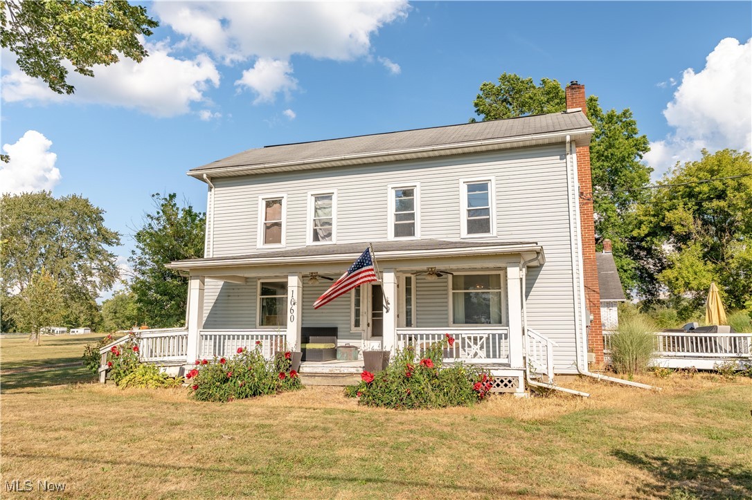 Step into history and comfort with this one-of-a-kind 1901 home offering timeless character blended with modern updates on 5.75 scenic acres in Deerfield. This spacious 4-bedroom home includes a convenient first-floor primary suite with a stunning full bath featuring custom tile walls, tub surround, and a preserved original sliding barn door. Upstairs, you’ll find 3 additional nicely sized bedrooms. The heart of the home is the large country kitchen, showcasing original cabinetry enhanced with Italian granite countertops and a large center island. Enjoy a cozy living room with a stone wood burning fireplace, exposed original ax-cut beams, and hand-hewn floor joists that highlight the home’s unique history. Additional conveniences include first-floor laundry and more than 10 ceiling fans throughout the home both inside and outside. Outdoor living shines with a covered wraparound porch, 17x20 deck with granite counters, and beautifully landscaped grounds featuring mature hibiscus plants, ornamental grasses, and many apple and Bartlett pear trees. Trails wind through the wooded and natural acreage, offering endless opportunities to explore nature and enjoy the wildlife. The amazing attached 3-car garage, currently used as a rec/family room, is complete with an electric fireplace and wood-burning stove. A 28 x 48 barn with concrete floor and electric provides space for a workshop, equipment, or storage, plus there’s a second smaller barn for additional flexibility. This home also features many newer vinyl windows and sliding doors, updated 200-amp electrical service with sub panel and 220, and plenty of space for hobbies, work, or play. All just south of the Deerfield Circle and close to the banks of Berlin Lake, this is a rare opportunity to own a piece of history with all the charm, character, and land you’ve been searching for.
