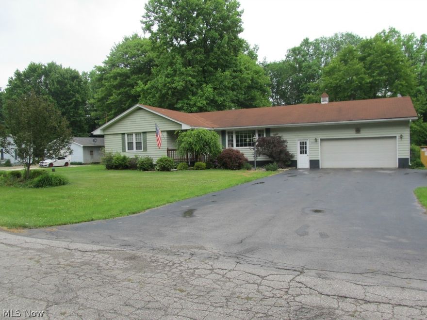 Drastically Reduced! Motivated Seller Make an Offer!!!! Quality and pride of ownership show in this custom built one owner ranch home located on 4.44 blissful acres & quiet dead end road in LaBrae School District.  No words can describe the ingenuity & craftsmanship this owner possessed in 1962. The large living room with picture window leads to an open & spacious eat in kitchen with custom oak cabinets & island/bar. Rear kitchen door leads to 12x12 covered deck overlooking the picturesque view of the large yard & extra wooded lots.  3 nice sized bedrooms, oak hardwood floors under carpet, plaster walls & updated windows.  There is a large family room or 4th bedroom in the walk out basement & much more room for storage or untapped potential. 2 car attached garage,wide black top drive. The acreage consists of 5 parcels & opens up in the back  to 230 ft. of water front access.  This land provides recreation of all types:  four wheeling, fishing, boating, camping....The possibilities are