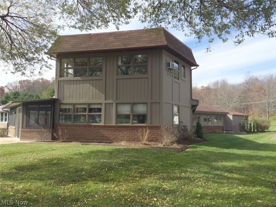 LAKEFRONT home situated on flat lot that includes cement driveway with plenty of parking area. Quality built,  open floor plan with lake views from almost every room. Living room has floor to ceiling custom brick fireplace that is woodburning. Exterior painted and new garage door installed October 2015. Interior is well maintained with neutral decor. Kitchen has been updated. Entertaining is easy with large kitchen and built in brick grill.  Masterbedroom has full bath and offers wonderful lake views. Quality built and well insulated for year round living.  Spacious enclosed porch overlooking the lake has three skylights and wall of windows with a sliding glass door that leads to cement patio and a walkway to covered picnic pavilion. Start enjoying lake living now.....it is never too late.