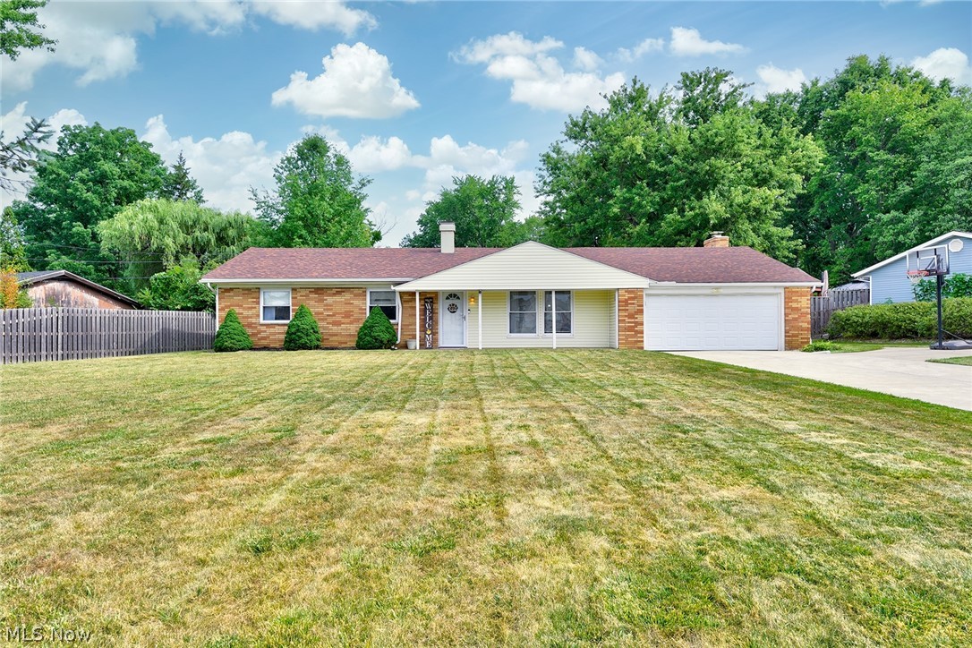 Pride of ownership abounds in this remarkably well maintained, clean and sunny ranch home! Stunning remodeled kitchen with tons of cabinet and counter space, updated vinyl plank flooring, and newer paint. Vaulted living room opens to the dining room. Family room with a gorgeous mid-mod fireplace and sliders out to the private fully fenced back yard. Spacious bedrooms. Full bathroom in the hall and en suite half bath off the primary bedroom. New roof in 2020. Dont miss this one!