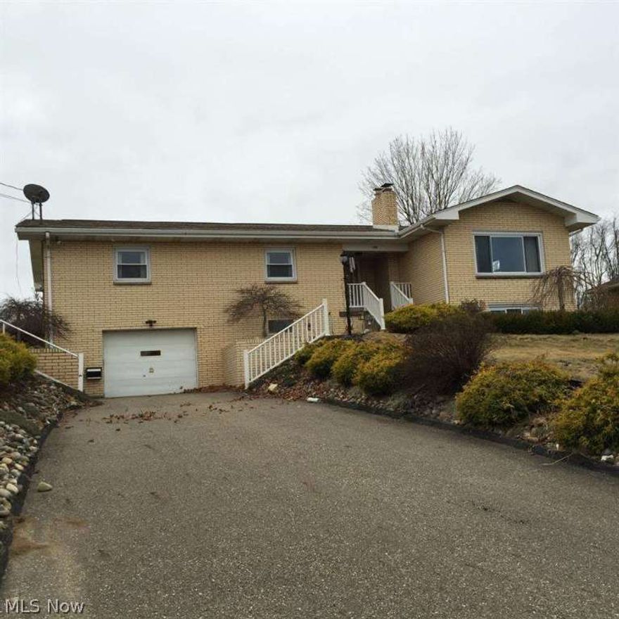 3 bedroom brick ranch with 2 full baths. Kitchen has been remodeled and laminate floors throughout the upstairs.