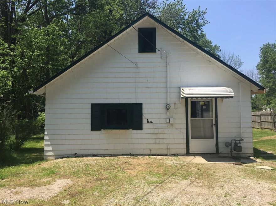 Cozy Two Bedroom Ranch nestled on deep wooded lot in popular Willoughby Hills.  Extra three season room looks out to beautiful wooded view.  Two car garage and addition offers extra storage!  Convenient location close to shopping and freeway!  Come take a look!  Great opportunity!!  This is a Fannie Mae Homepath home.  All information is approximate.