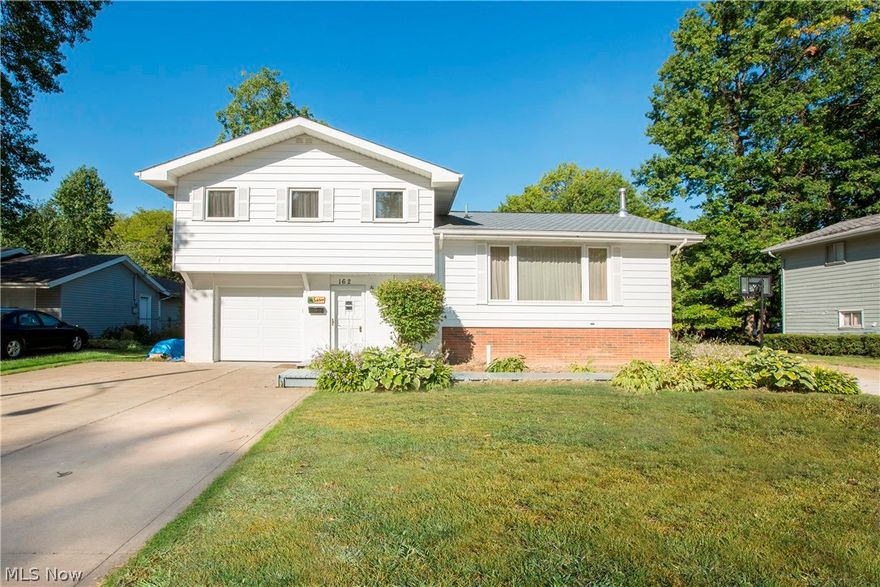 Not your average HOME! Many upgrades throughout both cosmetically  and mechanically. Versatile home ready to be moved into situated on Beautiful street in Walking distance to redwood elementary school, parks, and lake. New city storm sewers installed and assessment paid in full. Upgraded detail trim and wood work thru-out. Classy white beamed ceiling in living room, double & single crown molding thru-out, base molding, picture frame molding, new white and glass doors. Brand new carpet in Sept. of 2015. 4th bedroom could be used as a perfect office and is located on foyer level with 1/2 bath Basement recently finished & high-end "Endeavor" wood burning stove by Lopi. Great for winter days & nights, cutting down on heating bills. Eat-in kitchen w/double doors to back deck overlooking large backyard.  Fruitful urban garden completed w/brick pavers, flower beds, berry bushes & concord grape vines. Backyard shed stays. House has 2 driveways. Single car garage w/extra car pad. Additional dri