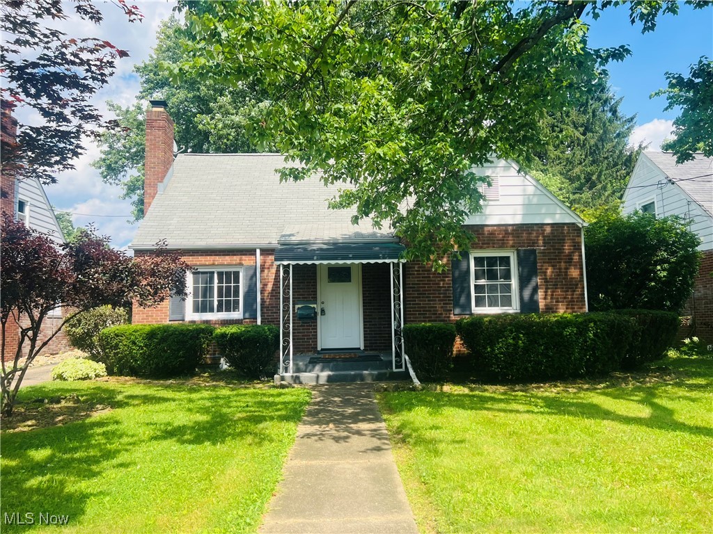 Charming All-Brick Bungalow ideally located near the sought after Historic Ridgewood neighborhood. It offers three spacious bedrooms - two on main level, two full baths.This home blends classic charm with modern updates for comfortable living and entertainment. Not one but two cozy fireplaces, vinyl replacement windows, hardwood floors, a formal dining room, and a fully finished basement featuring a built-in bar-perfect for hosting guests or creating recreation space.Updates within the past year include: all appliances, countertops, HWT, HVAC, two garage doors and systems, carpet, and more. Enjoy the privacy of a fenced-in backyard and the convenience of an attached two-car garage. This home offers the perfect combination of timeless construction and thoughtful, modern improvements. Agent owned.