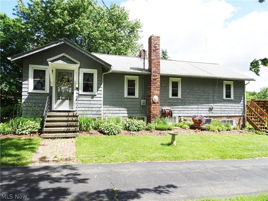 Quaint bungalow on over six acres and a huge barn! This house features gorgeous hardwood flooring throughout, an updated kitchen with oak cabinets AND all kitchen appliances stay with the property!  The living room has beautiful french doors that lead to a family room featuring built in cabinets and a fireplace plus there's plenty of windows to allow natural light to shine through.  Spacious master bedroom with two closets.  Off the dining area there's a door that leads to a large deck overlooking the barn and backyard. Lower level has an additional room that could be used as a mud room, additional recreational area or small suite.  Lower level features what once upon a time was the original kitchen in this farm house--cabinets and sink are still in tact! Plenty of storage and attached 1 car garage. Updates include new barn roof (installed 6/13/16); new garage overhead door and newer septic system (2014). If country living is what you've been looking for but within minutes from the hig