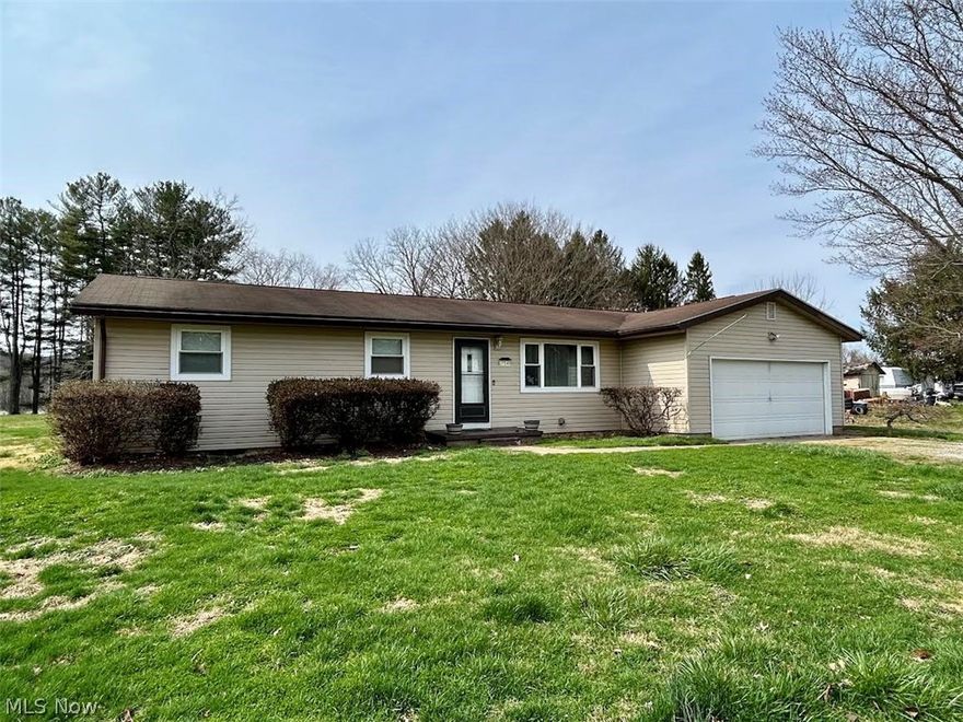 Reno Ranch! Enjoy one floor living in this three bedroom, one bath home featuring a versatile bonus room.  Situated on a level, sprawling half-acre lot, this property offers significant outdoor space and privacy while conveniently located for an easy commute.
The bonus room has a French door to the back yard and could be used as a family room, office, playroom, etc. Other features include a two car attached garage with extra space for a workbench or storage and unfinished basement.  Chain link enclosed fence area and storage shed in back yard. The Ohio River can be seen from your back yard but the property is not in the floodplain. The very top of the driveway is used by the next door neighbors to gain access to their own separate driveways. Immediate possession. Make your appointment today to see all the potential this home has to offer!