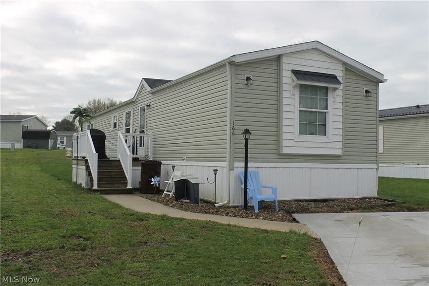 Welcome to this well-maintained 3-bedroom, 2-bath mobile home located in the desirable Melrose Village community! Offering over 1,100 sq. ft. of comfortable living space, this home features a functional and inviting layout perfect for everyday living and entertaining. A welcoming deck greets you as you enter into the spacious living room, which flows seamlessly into the eat-in kitchen—ideal for gatherings and creating an open, connected feel. The kitchen is highlighted by warm oak cabinetry, ample counter space, and sleek black appliances that add a modern touch. Down the hall, you’ll find the owner’s suite complete with a full private bath and generous closet space. Two additional nicely sized bedrooms, a second full bath, and a convenient laundry area complete the interior. Outside, enjoy the convenience of a concrete parking pad with space for two vehicles, along with a storage shed to meet your extra storage needs. Melrose Village offers fantastic community amenities including scenic fishing ponds, playgrounds, and a community center available for private events and gatherings. Conveniently located, this home is a great opportunity for buyers seeking comfort, value, and a welcoming community to call home.