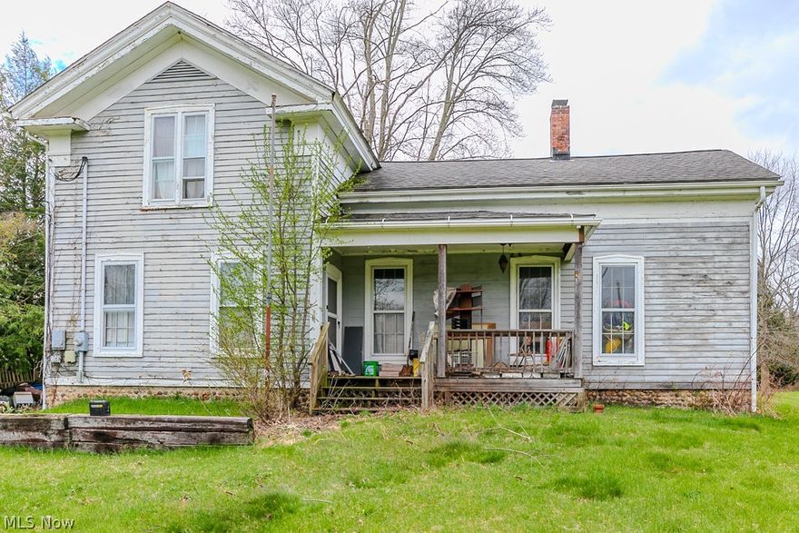 Prime location on Dock Road. Looking for acreage to build your future dream home. This property has 6.72 acres.  
Home is a possible tear down or labor of love. Being sold As-Is no repairs.