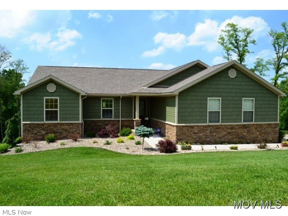 Beautiful, ready to move into custom built home. Offers open concept living with kitchen/dining/family room one big room with vaulted ceiling, wood floors, oak cabinets w/ granite countertops, pantry, island and door to back 12'x24' freshly stained deck offering a beautiful wooded view. Master suite has additional sliding door to back deck, oversized custom walk-in tile shower with double shower heads and seat, spacious 29x30 great room in walk-out basement with fireplace and custom, oversized bar for entertaining. 5th bedroom off kitchen would make a fabulous home office/study. #693 Elem: Little Warren Elementary Elem/Bus: Y JrHigh: Warren Middle JrHigh/Bus: Y High: Warren High School High/Bus: Y Fire: VOL Police: SHF PossFreeGas: N ;SQFT=Fin L1:1778, Fin Bsmt:1658, Fin Above:1778, Fin Total:3436, Unfin Bsmt:120, Unfin Above:120;GAR= 2 Car Att, Opener(s);PRKG= Off Street