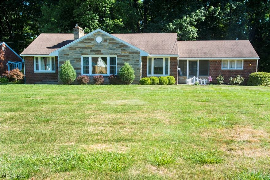 Welcome to this charming, move-in ready ranch located on a cul-de-sac street in Boardman! Step into the large living room with real oak hardwood floors, cove ceilings and a wood burning fireplace! The dining room has a large picture window and a cute corner built in cabinet! Updated kitchen has stainless steel appliances, granite countertops, and newer cabinets and backsplash. This home features 3 bedrooms with oak flooring throughout. The bathroom has been updated as well with ceramic tile and vanity! The basement has many possibilities with a large fruit cellar, recreation room with a floor to ceiling brick fireplace and is already plumbed for a half bath.  Walk out into the breezeway that leads to a secluded backyard with a pathway to Mill Creek Park! Updates also include blown in insulation, newer windows and sump pump. 2-10 Home Warranty is offered by the seller for a worry free purchase!