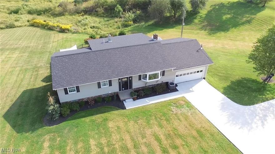 Beautiful remodeled home with custom updates.  Open concept Living, dining, kitchen.  The recent updates included taking out walls reconstructing kitchen, adding Shiplap planks to the ceilings, and new luxury vinyl planks throughout the upstairs.  A master ensuite bath with FlexStone shower surround and reinforced shelf for leg shaving, double sinks with extra outlets inside cabinets and walk in closet was added to provide a true Master ensuite.  This home provides an abundance of natural light from front bay window to sliding doors which  provide access to the luxurious outdoor living space.  You will enjoy relaxing by your inground pool complete with a new pump installed in 2025  and diving board.  Pool Shed will stay as well as the cleaning robot and new solar cover.  The third bedroom is on the lower level.  The bonus room could be used as a 4th bedroom with this homes 3rd full bath providing another private guest room.  The wiring in the home was recently updated as well as exterior drainage from the downspouts was ran away from the home and landscaping upgraded.   The lower level family room is the only room left  for you to remodel and make your own.  It boasts a  brick woodburning fireplace and an additional heat source a propane heater.  This home also includes a over sized 2 car attached garage, covered rear porch and patio overlooking pool and a  landscaped yard, all on 1.74 Acres.   Schedule your showing to see this Lovely move-in ready home. No mineral rights are owned by seller.  Possession 30 days after closing is negotiable.