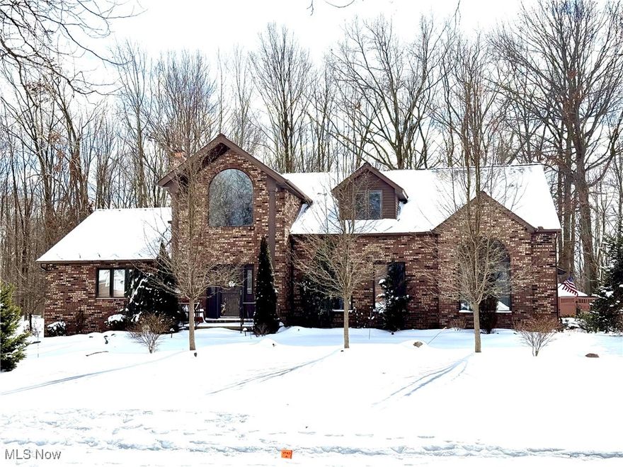 Discover this exceptional 3-bedroom home, with the potential for a 4th bedroom, located in the desirable Mayfield Village. This remarkable property features 4 full bathrooms and 2 half baths, making it perfect for families and entertaining guests. Step into the inviting eat-in kitchen, adorned with beautiful granite countertops and an abundance of cabinet space, ideal for all your culinary needs. The spacious living room boasts charming beamed ceilings and stunning hardwood floors throughout, creating a warm and welcoming atmosphere. The finished basement is a true highlight, offering a second kitchen, a cozy media area, and a large playroom perfect for family gatherings and recreational activities. The primary bedroom is conveniently located on the first floor, complete with a luxurious primary bath, ensuring comfort and privacy. Each bedroom is equipped with its own full bathroom, providing convenience for family and guests alike. The property also features a large heated garage with durable nature stone flooring, along with a practical mudroom that adds to the home's functionality. Step outside to enjoy a large patio equipped with an outdoor fireplace and a pizza oven, perfect for entertaining or relaxing evenings under the stars. The fenced-in backyard offers a private space to entertain. Don't miss this incredible opportunity to own a versatile and beautifully designed home in Mayfield Village. Schedule your showing today!