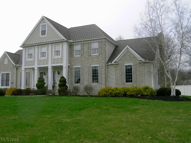 Beautiful former Model Home with open and spacious floor plan. 9' first floor ceilings, cherry kitchen cabinets, Granite counter tops, updated stainless appliances (Electrolux double oven, Samsung French door refrigerator, Electrolux dishwasher), updated baths with newer tile and granite. Large family room with gas fireplace and vaulted ceiling open to Sun room. Master bedroom has Coffered ceiling, Glamour bath with whirlpool tub, newer title and granite counter tops on his/hers vanities, walk-in closets. all the upgrades including sprinkler system, central vac, security system, heated garage with water 90+ efficient furnace, 100 gallon HWT. This home is in Prestige condition located on a large lot with over one acre great for entertaining. Too many wonderful features to list. A must see!