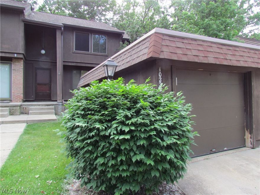 Well maintained condo in Aurora Shores. New hardwood floor in living room. New carpet in small bedroom and basement rec room, which has been freshly painted. Bath rooms are updated. All appliances remain.  Development features 2 swimming pools, 2 beaches, a Marina, a full basketball court, tennis courts and a 250 acre lake for boating.  Condo backs to green space.