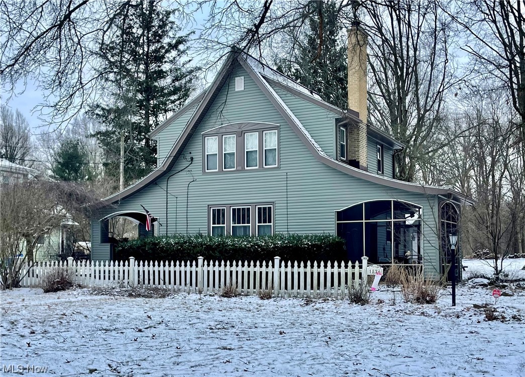 This is the one you’ve been waiting for! Welcome to 1826 Arndale Rd in the heart of Stow. This home greets you with an exquisite exterior- with not one, but two porches (one open and one screened). Nestled on picturesque yard with over a 1/2 acre, this is truly a rare opportunity to own a one-of-a-kind home. Inside is equally lovely, with loads of charm and stunning hardwood floors throughout. The kitchen is spacious and features ceramic tile, ample cabinet space, a swing out pantry, as well a French door stainless steel refrigerator and double sink. The living room and dining room are open and inviting, perfect for enjoying spending time with family and friends. The living room also boasts a cozy wood burning fireplace with white brick surround, arched entryways, and an opening to the staircase which adds to the character. The windows on the main level are East and West facing, which allows sunlight into the dining room in the morning for breakfast, and time to enjoy the sun again on the patio in the evenings as the sun sets in the West. On the second level you will find three nicely sized bedrooms, a full bath with a white subway tiled shower and beadboard wainscoting. The full basement provides ample storage space, and an additional bathroom w/ a standing shower. Updates include new siding (2023), new HWT (2023), new garage roof (2022), new resin in water softener (2022), & more. There is a 2-car detached garage, large driveway, a trellis, and tons of space for the family and pets to enjoy. A home warranty is included for peace of mind. Don't miss your chance to call this incredible house your home! Schedule your private showing today!!