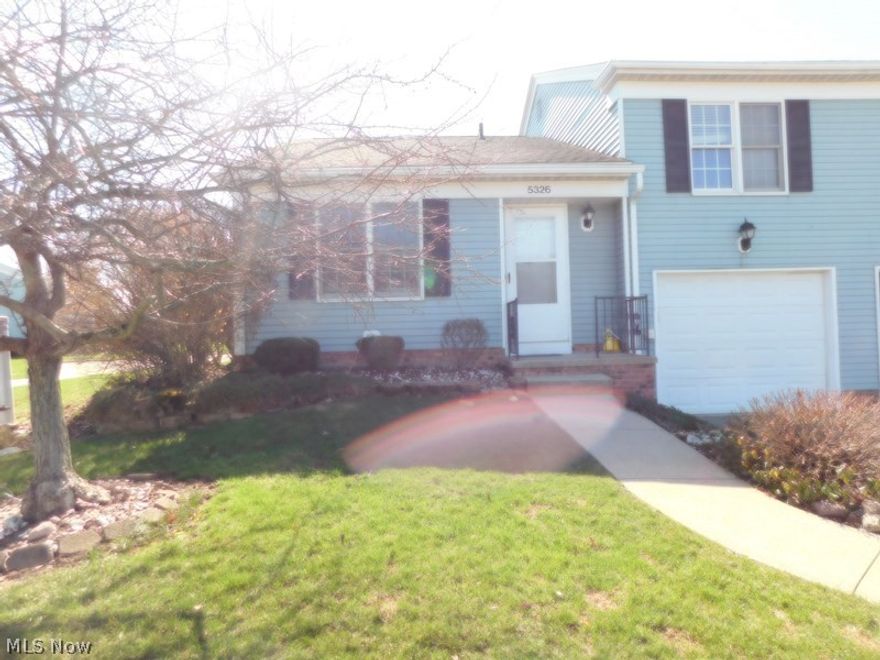 A little paint...a few updates any you've got a winner! This two bedroom, 1/2 bath split level cluster/townhouse has great space and bright open feel with a cathedral ceiling and skylight for lots of natural light in your entertaining size living room plus a nice size dining area with a ceiling fan..Primary bedroom with mirroed closet doors (great for those "How do I look today" moments)
Plus another generous size bedroom. Fully appliance kitchen with space for a small table. Extra large room with cabinets and storage area + washer and dryer stay. A tandam two car garage offers ample storage space and is two lengths deep so once you park yoour car you still have space for those bikes and things. Parking is easy for guests with additional parking just across the street. Relax on your patio sipping a glass of tea and reading a book, great place to have a meal with your frirends/family or just getting a tan. A Short distance away from variety of shopping and restaurants and other options at Strongsville South Park Mall and Medina Square. Don't forget the Brunswick Rec Center. Needs a little updating with paint and kitchen touches - an excellent change to add your own style while building VALUE! One year home warranty.