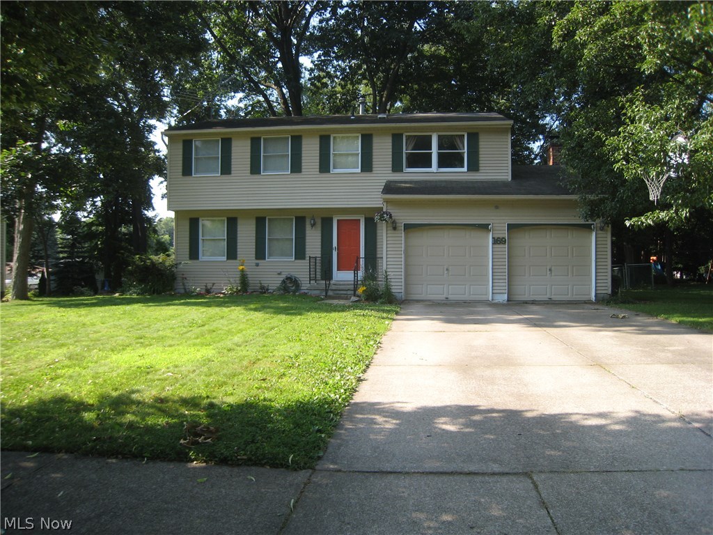 This four bedroom colonial is wonderful. The kitchen has be totally updated with stainless steel appliances,Corian counter tops and breakfast bar. The cabinets are Craftmaid. The are hardwood floors in the kitchen, living room and formal dining room. The family room has a wood burning fireplace and sliders out to the patio. There are four nice size bedrooms on the second level with a very rare walk in closet addition. The basement has a finished rec room with a full bath. The backyard is fenced with a play area. The furnace and central air BRAND NEW as of SATURDAY July 25th 2014. You wont be disappointed!