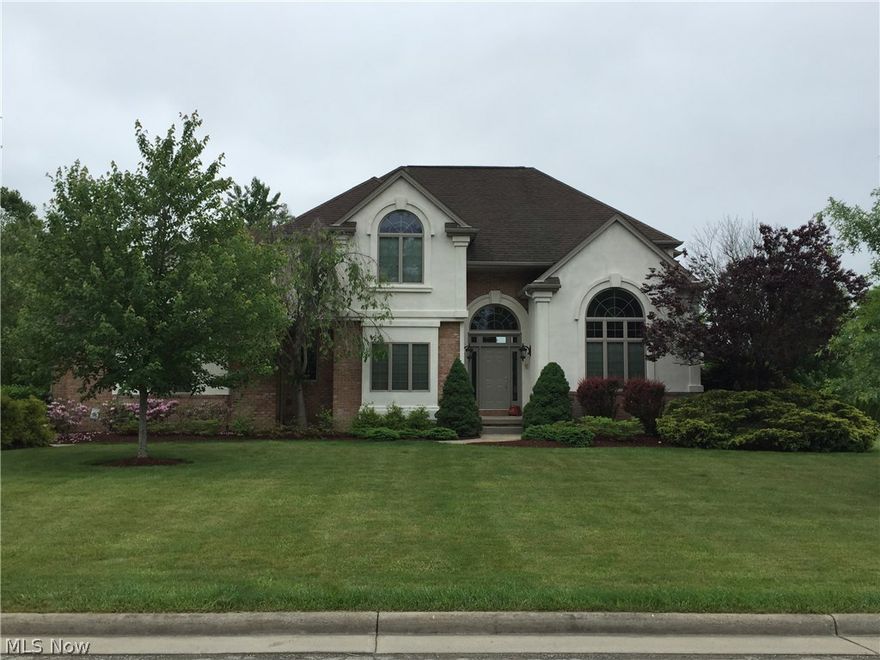 Looking for that dream home ? Look no further and move right in to this quality built 4 bedroom 4 bath brick 2 story home in Polands finest in
Canterbury Creek . Large open floor plan with beautiful oak trim thughout. Large kitchen with ceramic tile, family room with fireplace, large first floor master suite with master bath and whirlpool tub. Spacious bedrooms on 2nd floor. Formal dining room, full finished basement with rec room along with full kitchen great for entertaining. Beautiful ceramic tile throughout foyer and all baths. Freshly painted interior. After you have settled in to this spacious home you can head outside into an oasis of relaxation or entertainment in a park like atmosphere. Brick paver patios surround this double lot with built in fire pit, pond, bocce court, and outdoor bar with built in stanless steel gas grill. Come see this home for yourself before its too late !