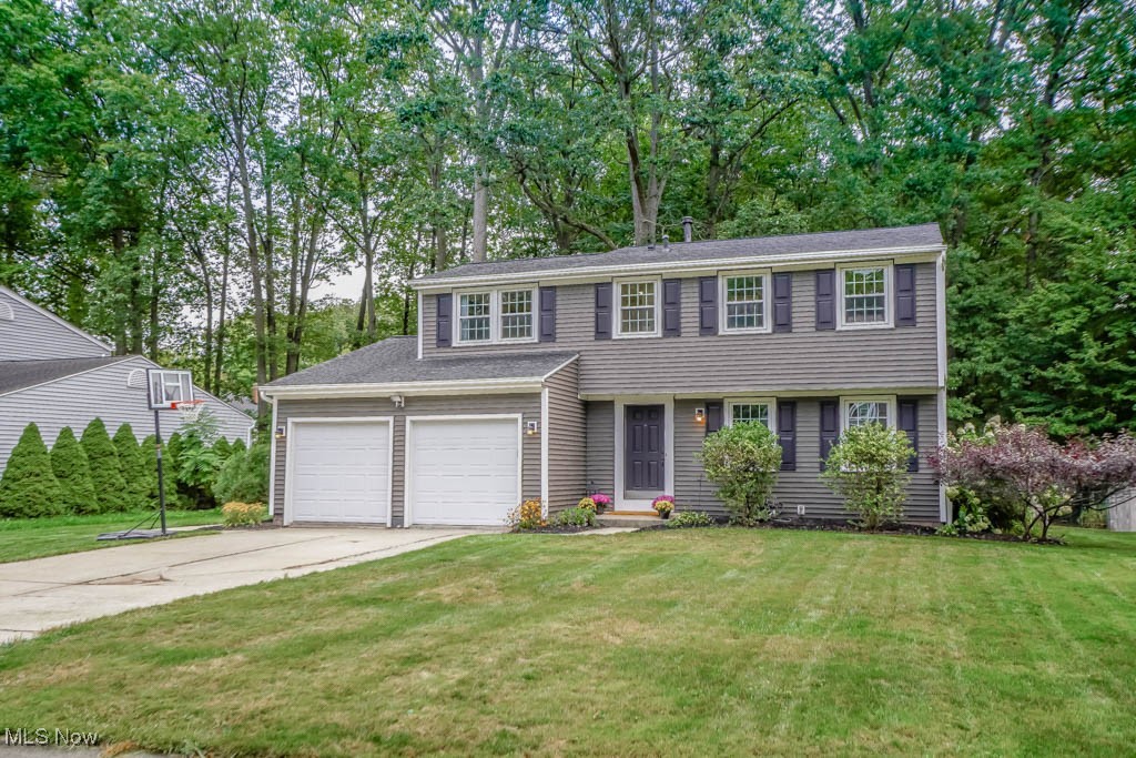 You’ll find a great mix of updates and living space in this Stow two story with a wooded backdrop! The main level includes a living room with luxury vinyl plank flooring that opens to the dining room accented with crown molding. The kitchen is ready for everyday meals and gatherings with quartz countertops, a tile backsplash, stainless steel appliances including a double oven, and breakfast bar seating with an open view into the family room anchored by a gas fireplace. A sliding door leads to a large patio and fenced backyard where kids and pets can play. A convenient half bath finishes the main floor.
Upstairs, the primary suite gives you double closets and a private bath featuring a dual sink vanity against a shiplap accent wall and a multi head tiled shower. Two additional spacious bedrooms share an updated full bath with a tub and shower combo.
The finished lower level adds even more room with a rec room perfect for movie nights, plus a laundry room and plumbing already in place for a half bath. A two car attached garage and storage shed keep everything organized, inside and out.
Updates include a newer roof, A/C, hot water tank, windows, siding, fridge, dishwasher, lighting, and interior doors. With so much to offer, this home is one you'll want to see. Call today to schedule your showing!