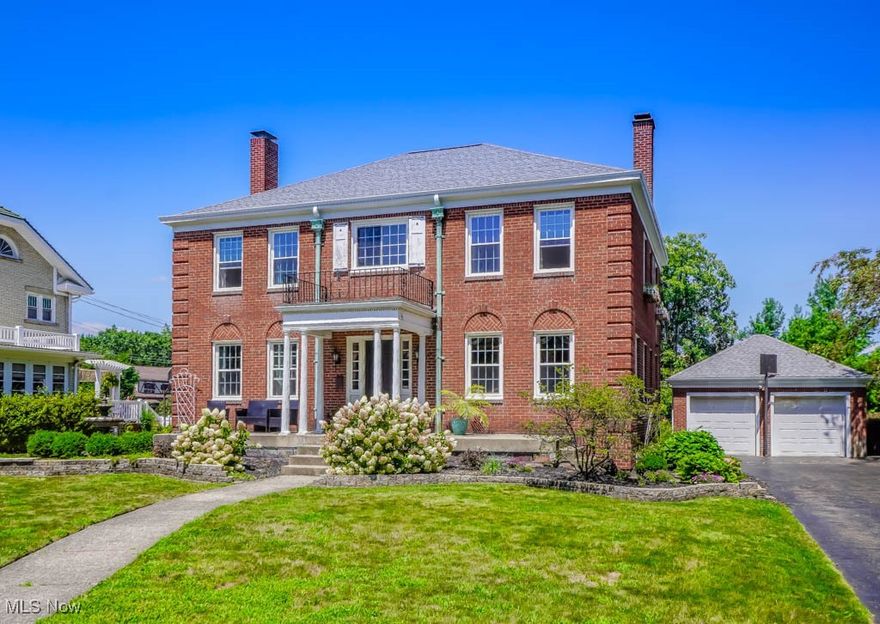 Stately and full of character, this brick Georgian colonial in Ridgewood offers nearly a century of charm with updates that make everyday living easy. The curb appeal draws you in with a welcoming front porch, leading to a center hall layout with hardwood floors and arched doorways. On one side, a formal dining room with a built in china cabinet, and on the other, a light filled living room with crown molding, a fireplace, and access to a cozy library with another fireplace and built in bookcases, just right for a reading nook or home office. The fully applianced kitchen has plenty of cabinet space and a sunny breakfast nook that’s perfect for morning coffee or casual meals. A half bath completes the main level. Upstairs you'll find four spacious bedrooms and two full baths, including a standout primary suite with its own full bath featuring a walk in closet, tiled shower, dual vanity, and penny tile floor. The main bath offers a tub/shower combo and an overmount sink, shared by the secondary bedrooms. The finished attic adds even more space with a fifth bedroom featuring hardwood floors, a dormer window, and high ceilings that give it a bright, open feel. The lower level offers a partially finished area for added flexibility, plus plenty of storage and all mechanicals. Step outside to enjoy the covered back porch or relax on the flagstone patio in the private, partially fenced yard. A two car detached garage and tree lined brick street add to the home's timeless appeal. A rare find you don't want to miss, call today!