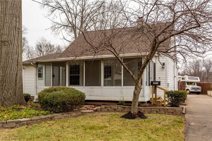 Crisp and clean! This charming, updated cottage with enclosed three-season front porch is set on an ample lot with fenced-in yard. Stepping stones & brick walkways provide a structural base to your landscaping finishes. The inside of the house has been updated with neutral colors. All new flooring throughout! The kitchen serves as a focal point for entertaining as well as gatherings. An updated bathroom with new plumbing creates a master suite with sliding doors to the backyard. A well appointed second full bath is on the main floor.  The upstairs beamed dormer will serve famously as a bedroom or office workspace. There is a well-designed laundry and mudroom to the outside on the first floor making for efficiency leading to the kitchen.  The unfinished basement has been updated with a newer furnace. A new electrical box, new wiring and new a/c round out the updates. There is a Cinch home warranty for peace of mind!