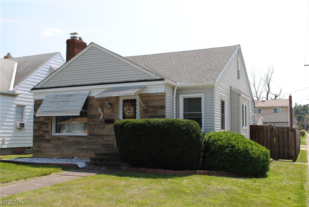 Charming Bungalow home on a desired street will impress. Warm living room with fireplace opens to dining room. Remodeled kitchen. Updated bath. 2 bedrooms on the 1st floor and 1 larger bedroom upstairs. Basement offers partially finished recreation room area, glass block windows and loads of storage. Newer furnace and central air. Some replacement windows. Updated electrical box. Stone front and vinyl siding. Wonderful deck and full wood privacy fence in backyard. Call agent today.