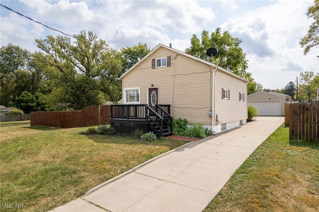 Nestled on a serene dead-end street, this charming two-bedroom, one-and-a-half-bathroom home offers a perfect blend of modern updates and cozy comfort. The updated kitchen, complete with all appliances, is a chef’s delight, ready for preparing meals and hosting gatherings. Newer vinyl flooring flows throughout the home, adding durability and a fresh, contemporary feel. The remodeled full bathroom on the main level boasts dual vanity sinks, providing a touch of luxury and convenience. One spacious bedroom is thoughtfully situated on the first floor, while the second bedroom resides upstairs, offering privacy and flexibility. Downstairs, the basement features a convenient half bath area with a toilet and sink, along with a laundry area equipped with a front-load washer and dryer. Outside, a large deck overlooks a private fully fenced-in backyard, creating an ideal space for relaxation or entertaining. A two-car garage provides ample parking and storage, completing this move-in-ready gem. Don’t miss the opportunity to call this beautifully updated home your own—schedule a showing today!