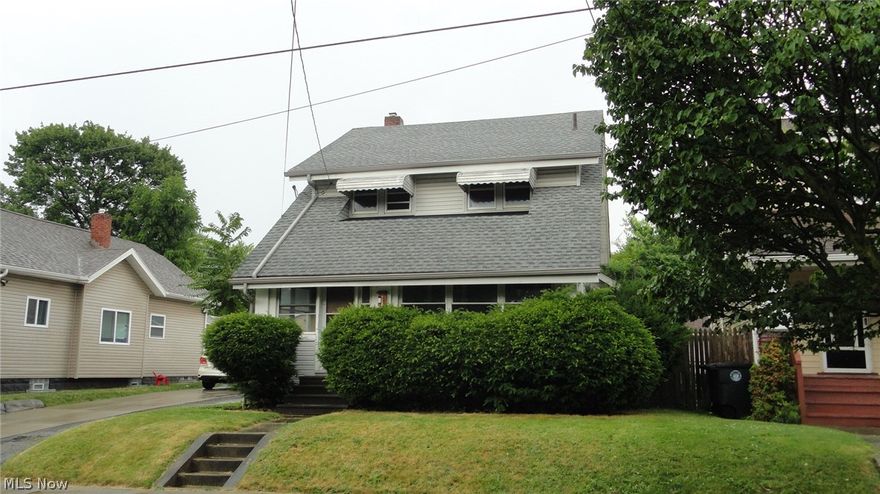 Here's a solid home in a nice area that has a  newer roof, electric and furnace but it needs some repairs and a total cosmetic renovation. It's a great floor plan with a large formal living room with fireplace,an eat in kitchen, a formal dining room, a large enclosed front porch plus a first floor bedroom and a first floor full bath! The second floor has three more bedrooms and a second full bath. Full basement and a 2 car garage. With the needed updates, it will be a nice home for the next family to enjoy.
