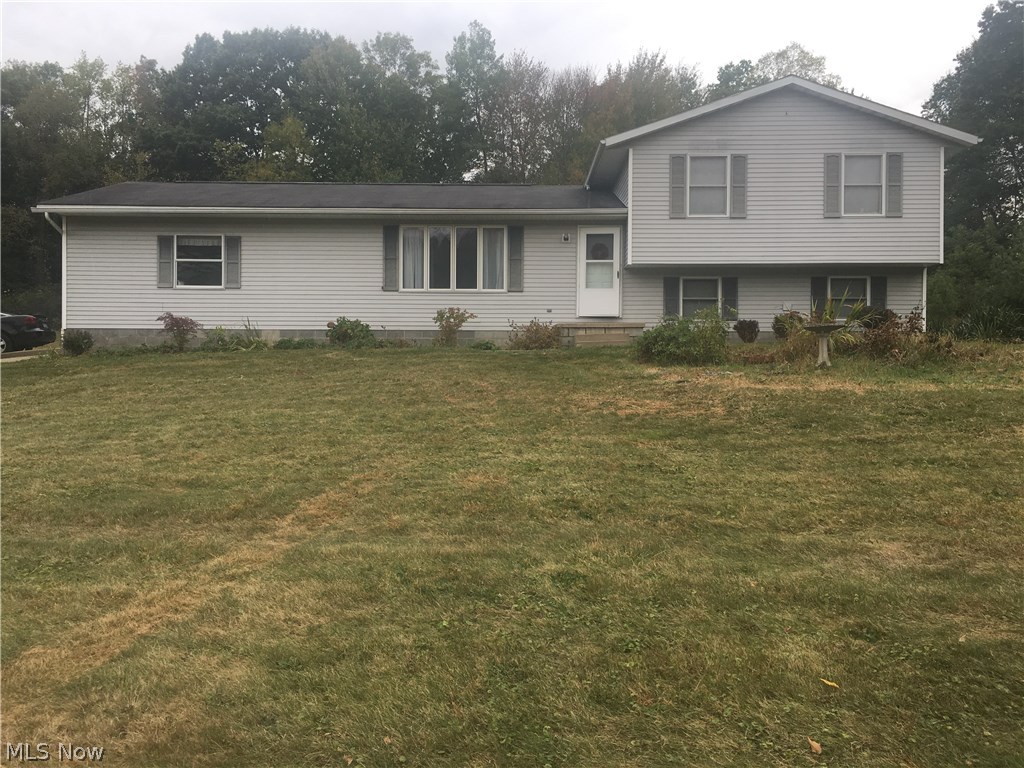 This 1994 four-level split is worth taking a look. Offering 2048 square feet of finished living space, 3 bedroom, 2.5 bathrooms, 9x15 lower bonus room, large eat-in kitchen, living room, and comfortable family room with beautiful stone fireplace. Located in Rootstown School System with Ravenna mailing address not too far from major highways (between Rt 44 and Rt 43). Attached 2 1/2 car garage with water. Good storage areas and closets, electric heat, movable kitchen wood block remains, master has own private full bath are nice features. Plenty of room to roam inside and out on lovely 1.71 acres on quiet country dead-end road. Great quiet location! Immediate possession offered. Nice gardening yard too. (See broker remarks)