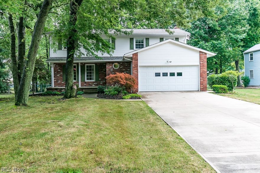 Located in the heart of one Mentor's most desired areas, this iimmaculately maintained 4 Bedroom, 2 1/2 Bath Colonial with newer driveway is available for immediate occupancy!!!  This home has a family-friendly floor plan, large room sizes, fenced-in yard and a 4 Season Natural Gas Heated Sunroom as well as a heated ceiling fan!  Inside, the kitchen has newer kitchen cabinets, corian counters, seamless undermount sink for easy cleanups, pull down faucet and planning center for bill pay and/or homework area for the kiddos.   The Owner's Suite is a 18' x 16' and has a 16' x 14' Master Bath/Makeup Area. The Owner's Suite has a connecting door to an adjoining bedroom that would be perfect as a baby/toddler room or exercise room/office space.  Downstairs, the 22' x 22' Finished Basement space offers loads of opportunities for additional living area/office/rec room.  Outside, the newer double cement drive welcomes you to a 2 car attached garage with a Naturestone floor and a welcoming front