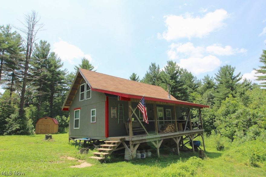 26+ wooded acres in Monroe County. Trails through property. 1+ acre opening for food plot. Great hunting opportunities. Wayne National Forest across the road. New 10x16 storage shed. 20x32 rustic cabin. Full 32x8 covered porch. Wood burner. Gas available. No electric,water or sewer. No mineral rights.