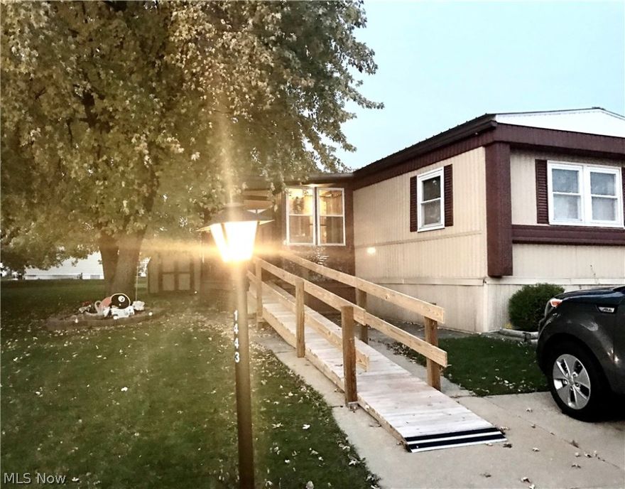 Streetsboro's Camelot Village- 3 bedroom, 2 full bath home. Handicap accessible with new ramp that leads to screened 17x9' porch. Newer roof, shed, and double pane windows. Electric range / oven will stay. Park offers new recreation party room, playground, basketball court, and covered outdoor pavilions. Monthly fee includes trash pickup and snow removal of the streets. Motivated Sellers!